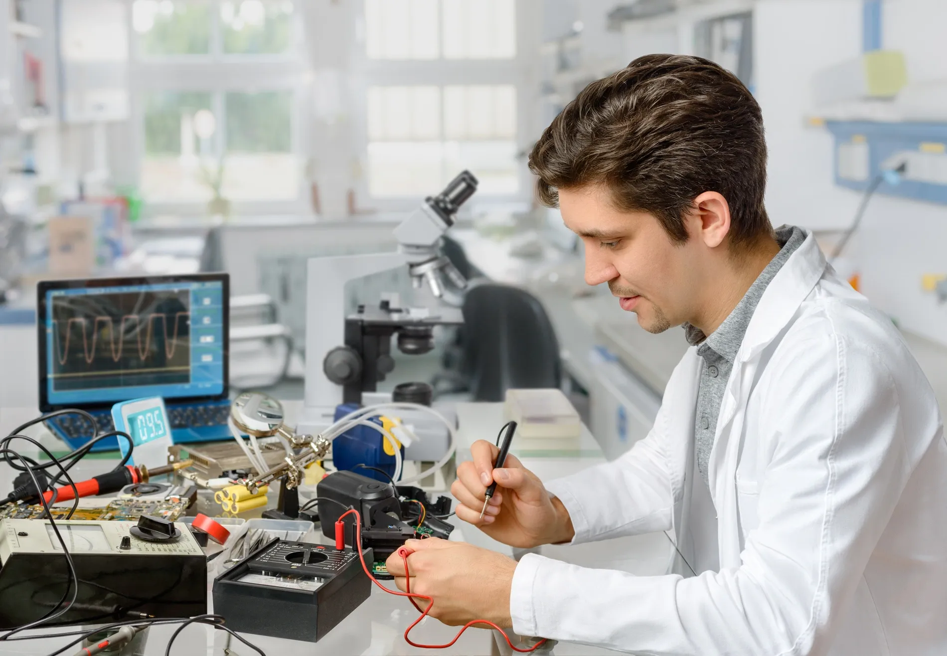 A man working in an electronics lab